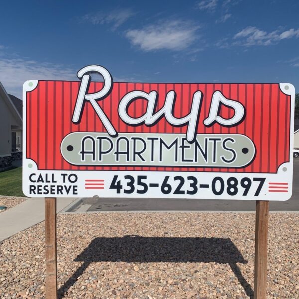 Rays Apartments sign with contact number 435-623-0897, promoting rental opportunities in Nephi, Utah.